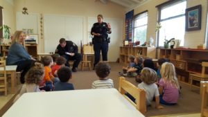 SFPD Vehicle in front of Rainbow Officers with students Montessori Pre- School 
